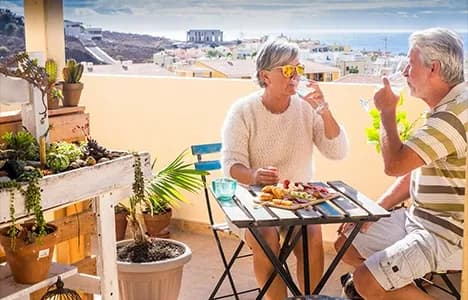 Retired couple talking together on a patio