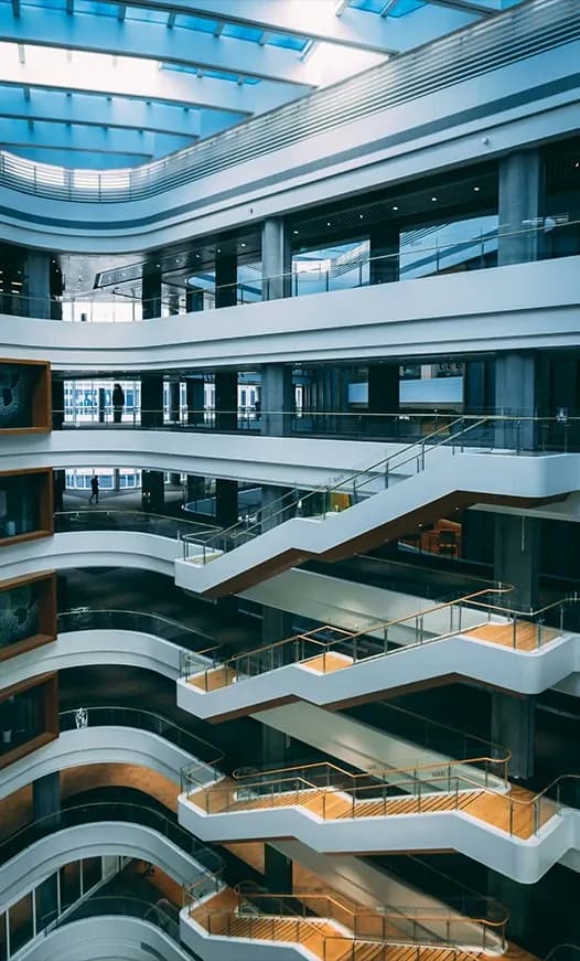 Open stairways connecting multiple levels of a modern building