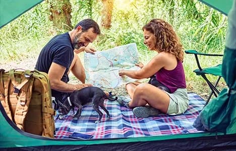 Couple reviewing a map outdoors